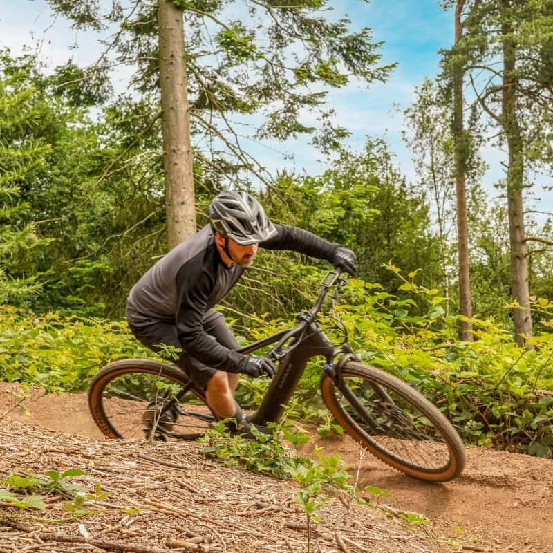 Claud-Butler-Wrath-2.0-Electric-Mountain-Bike-Outside-Woodland