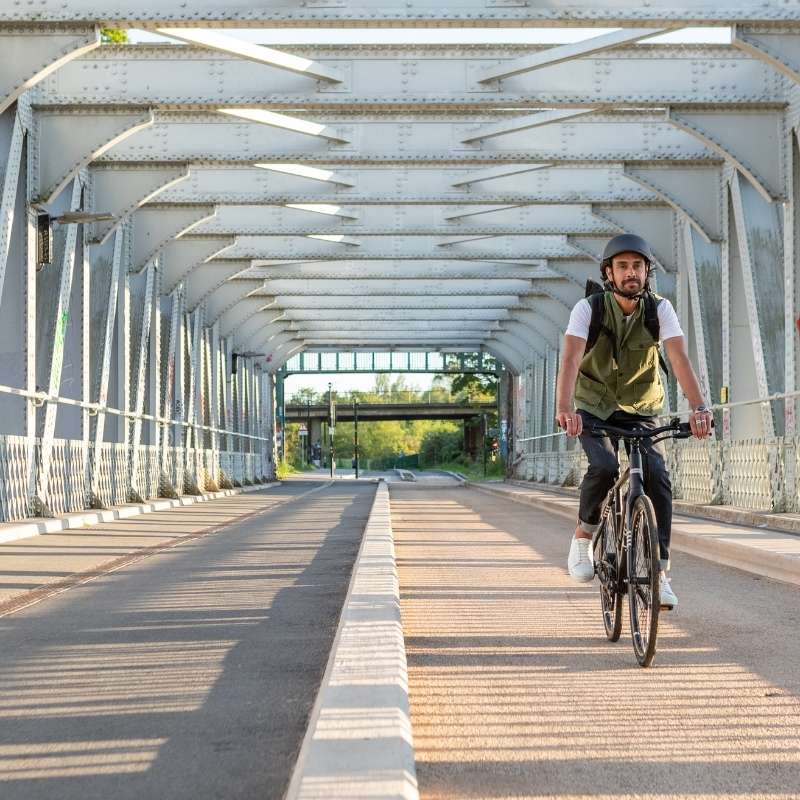 Pure Flux One Electric Hybrid Bike Ridden Through Bridge